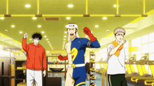 a man in a superhero costume stands in a gym