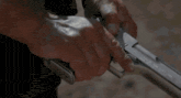 a close up of a person holding a gun