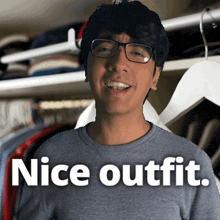 a man wearing glasses stands in front of a closet with the words nice outfit written below him