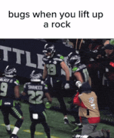 a football player with the number 22 on his jersey is being lifted up by another player