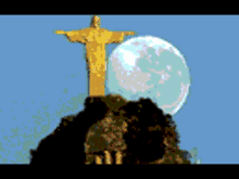 a statue of jesus with a full moon behind it