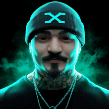 a man wearing a black beanie with a blue x on it