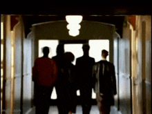 a group of people walking down a hallway with imgflip.com at the bottom of the screen