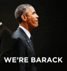 a man in a suit and tie stands in front of a black background with the words we 're barack