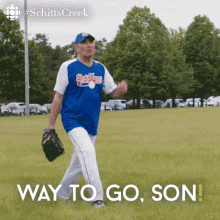 a man in a baseball uniform is walking in a field with the words way to go son below him