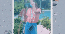 a girl in a pink shirt and blue shorts holds a cell phone