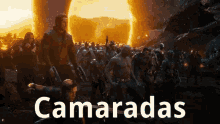 a group of people standing next to each other in front of a fireball with the words camaradas written on the bottom .