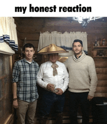 a man wearing a sombrero stands between two other men with the caption my honest reaction