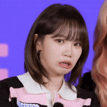 a close up of a woman making a funny face with her mouth open