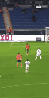 a soccer game is being played in front of a sign that says bein sports