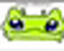 a blurred image of a green toy car with blue eyes on a white background .