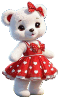 a white teddy bear wearing a red dress with white hearts and a red bow .