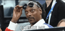 snoop dogg wearing sunglasses with the words excuse me behind him