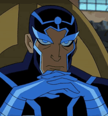 a cartoon character with a blue helmet and blue eyes is sitting with his hands folded