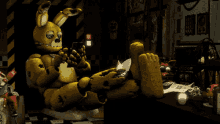 a yellow bunny rabbit is sitting on a table with its feet up
