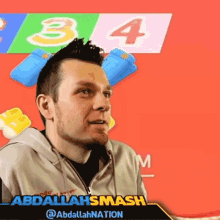 a man wearing a hoodie with abdallahsmash on the front