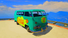 a green mystery machine van sits on a beach