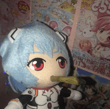 a stuffed doll with blue hair and red eyes is eating a piece of food