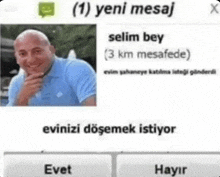 a picture of a bald man in a blue shirt is on a screen with a message from selim bey .