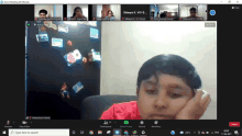 a screen shot of a zoom meeting with a boy