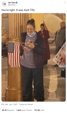 a tweet from jim tews shows a woman with an american flag