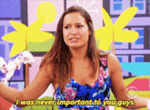 a woman says i was never important to you guys in front of a colorful background