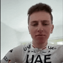 a man wearing a shirt that says uae on the front