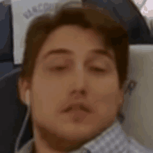 a man is sleeping on a vancouver airlines seat