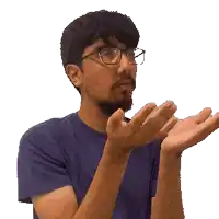 a man with glasses and a beard is clapping