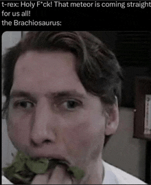 a man eating a piece of lettuce with a caption that says t-rex holy f * ck