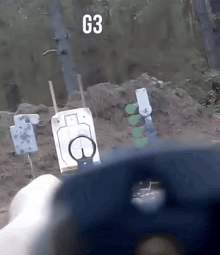 a g3 sign is above a shooting range