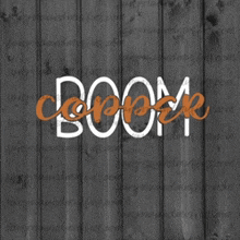 the word boom is on a wooden surface