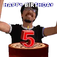 a man is celebrating his 5th birthday with a cake and a candle