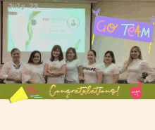 a group of women standing in front of a projector screen that says protector