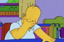 homer simpson from the simpsons is covering his face with his hand