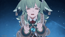 a girl with green hair and a necklace with the letter o on it