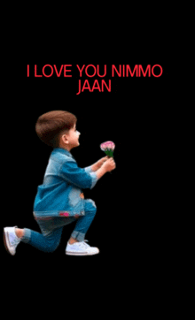 a little boy is kneeling down and holding a flower with the words " i love you nimmo jaan " written above him