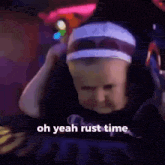 a baby wearing a headband is sitting in a chair .