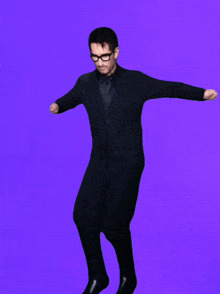 a man wearing glasses and a black coat is dancing on a purple background