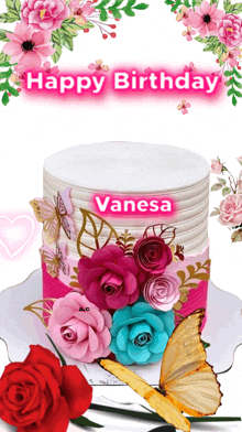 a birthday cake with roses and butterflies and the name vanesa