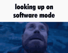 a man with a beard is looking up at the sky with the words " looking up on software mode " above him