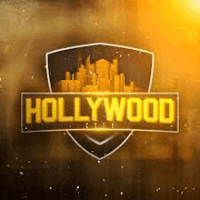 a logo for hollywood city with a shield and a city skyline in the background .