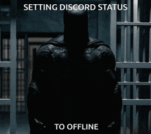 batman in a jail cell with the words setting discord status to offline below him