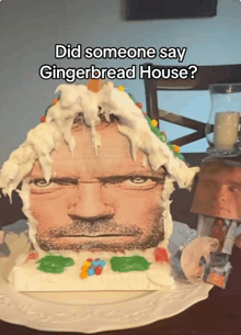 a gingerbread house with a picture of a man on it