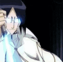 a man in a white shirt and tie is holding a sword in his hand .