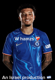 a man wearing a blue shirt that says hamzs on it