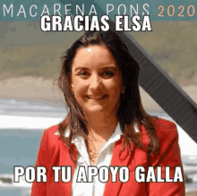 a woman in a red jacket is smiling and says gracias elsa