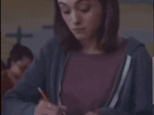 a person is writing on a piece of paper with a pencil and the word graceful is highlighted