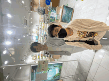 a man wearing a mask stands next to another man in front of a sign that says ' nature republic '