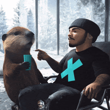 a man wearing a black shirt with the letter x on it sits next to a beaver